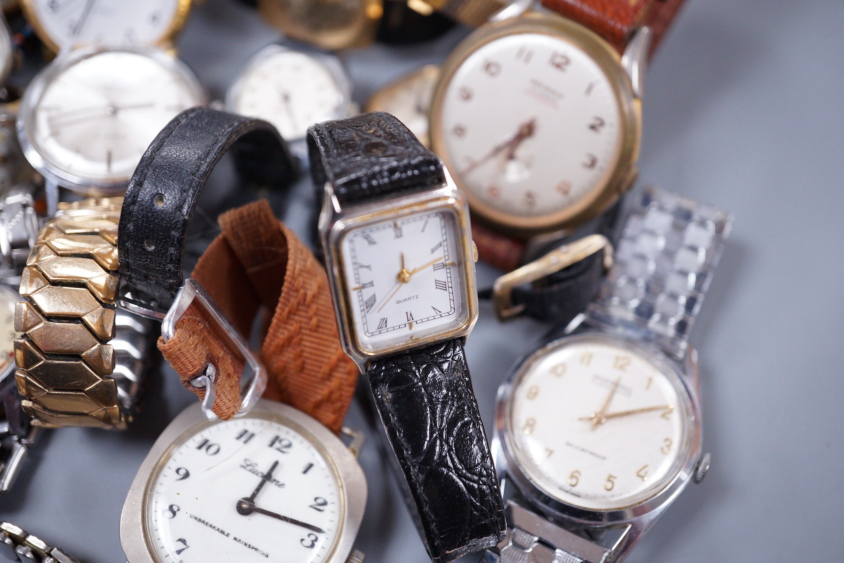 Seven assorted gentleman's wrist watches including steel Ingersoll and steel Technics, Adano and Sekonda and twelve assorted lady's wrist watches including Timex, Editia and a yellow metal Winegartens.